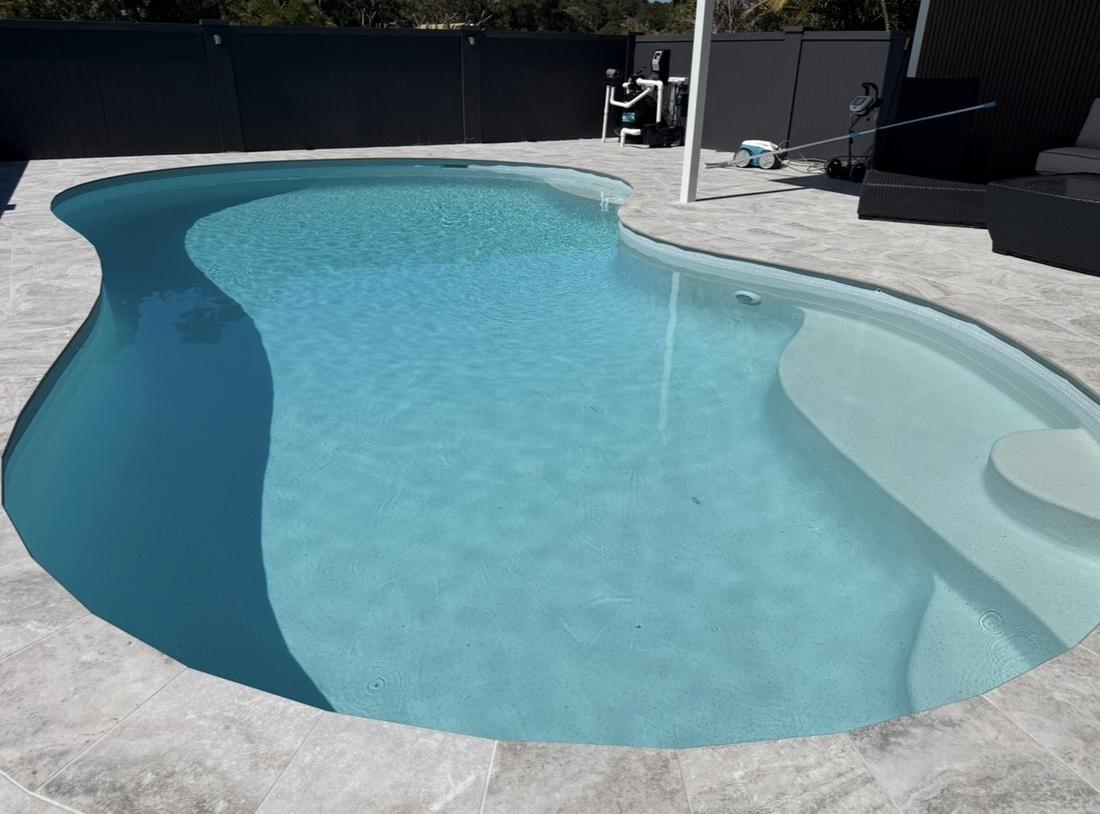 Crystal-clear lagoon-style pool maintained by Blue Avenue Pools, Gold Coast